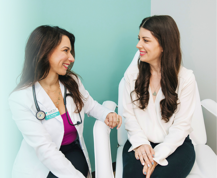 Medical professional speaking to a patient